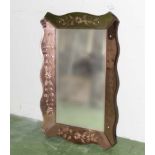 An Art Deco mirror with pink etched border