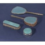 A four piece engine turned enamel dressing table set