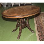 An inlaid mahogany tilt top table