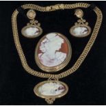 A cameo pendant, brooch and earrings set