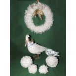 A white feather Christmas wreath together with a goose and four feather baubles