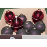 Three large ruby red quality Christmas baubles together with six smaller blue baubles