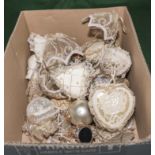 A box containing gold and silver lace Christmas decorations