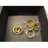 A group of 9ct gold and yellow metal hoop earrings, total weight, 14g