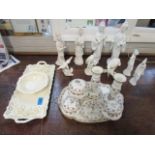 A selection of blanc de chine figurines, bisque bird figures, Limoges dressing table set and other