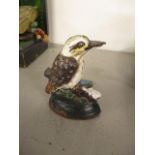 A painted cast iron door or window stop fashioned as a bird on a plinth, 3 3/4" h