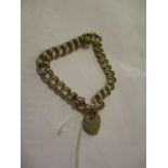 A yellow gold Belcher link bracelet with a 9ct gold heart shaped catch