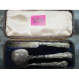 A Victorian leather cased, silver three piece christening set, comprising a knife, a fork and spoon,