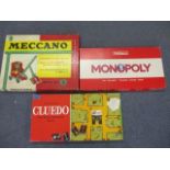 A vintage Meccano Outfit No 5, boxed and two other board games, along with vintage carpet bowls