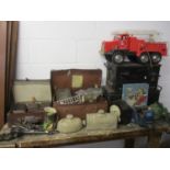 A mixed lot to include books, a Fire Brigade truck, a Smiths clock, boxes and other items