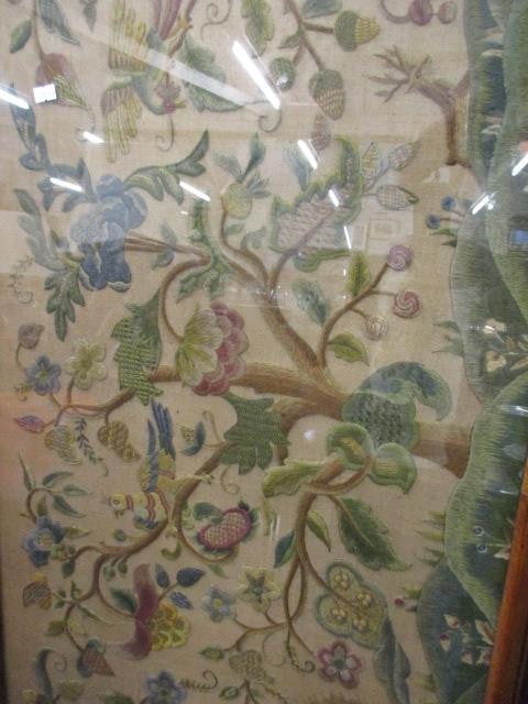 An early 20th century mahogany framed and glazed tapestry depicting birds in blossoming trees, 20" x - Image 2 of 2