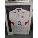 An England rugby shirt signed by the members of England team, dated 2004, framed and glazed