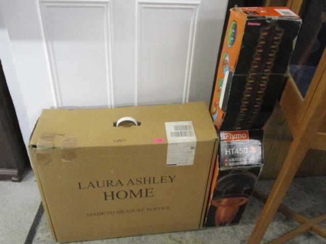 A Flymo hedge trimmer (unused) together with a pair of floral pattern curtains in a Laura Ashley box