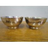 A pair of Iranian white metal bowls with Niello decoration of boats in a coastal scene, 111g