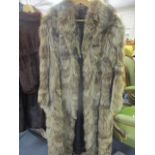 A retro 1970s Dutch raccoon full length coat, approximate size UK 14, measuring 47" in length