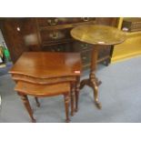 A Victorian mahogany pedestal table and a nesting set of three modern tables