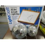 Two glitter balls and a boxed A3 Arts & Crafts light box