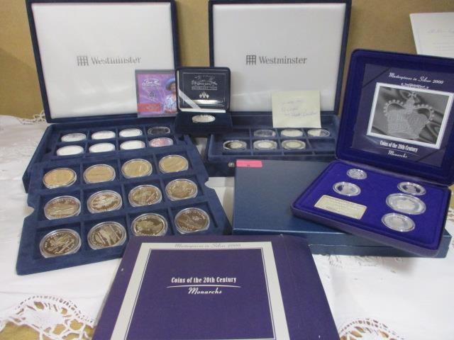 A Westminster silver proof set of twenty four Man in Flight coins, a five coin Masterpieces in