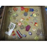 A selection of medals and badges to include a Coronation medal, a Russian medal, a Royal Engineers