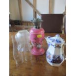 A Victorian painted pink glass oil lamp with etched glass shade and two glass funnels, together with