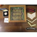 Military items to include cloth badges, a silver proof £2 coin and six naval buttons