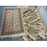 Two rugs to include one having a beige ground and multiguard borders, 55" x 32"