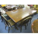 An oak refectory dining table together with a set of six spindle and wheel back chairs, 30" h x 59