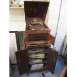 An early 20th century His Masters Voice model gramophone, together with a record cabinet and mixed