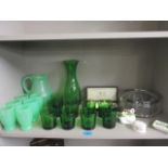 An early 20th century green vitrified glass water set, a later green glass water set and other items