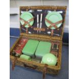 A vintage picnic basket with contents