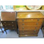 An early 20th century oak chest of five long drawers and a mahogany bureau