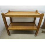 Robert Mouseman Thompson, an oak two tier tea trolley with carved mouse signature to one corner,