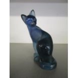 Claude Lhoste for Daum, a blue glass pate surVerre model of a seated cat with head turned,