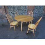 An Ercol Windsor light elm and beech drop flap dining table, model 384, 28 1/2" x 44 1/2" x 39 1/