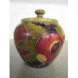 A William Moorcroft Pomegranate pattern preserve pot and cover, having stamped factory marks and