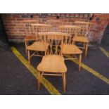 A set of six Ercol Shalstone dining chairs, mid 20th century black and gold label to seat edge