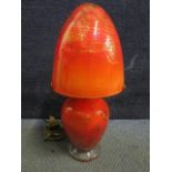 A signed continental red glass table lamp and matching shade with random line and gold leaf