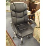 A modern leather swivel office chair