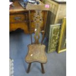 An early 20th century oak spinning chair