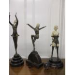 Three modern Art Deco design, cast metal and composition figures, each on a mottled, composition