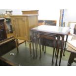 An early 20th century French style pot cupboard, together with a nest of three reproduction tables