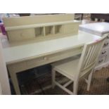 A modern cream painted desk and matching spindle back chair