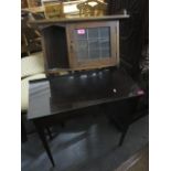 A small Arts and Crafts oak wall hanging bookcase, together with a mahogany side table