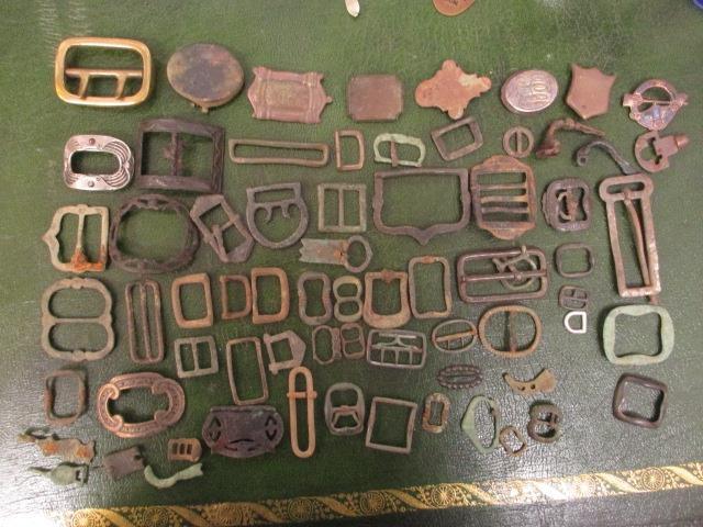 A collection of metal detector finds, mainly buckles and artefacts to include early bronze, brass,
