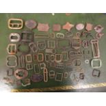 A collection of metal detector finds, mainly buckles and artefacts to include early bronze, brass,