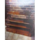 A Victorian mahogany four tier graduated wall hanging bookcase with two fitted drawers below