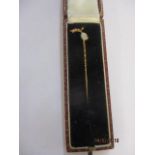 A 15ct gold, opal and seed pearl stick pin, total weight 1g