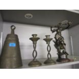 Metalware to include a Middle Eastern bronze bell, a bronze figure of a woman and a pair of brass