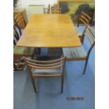 A G-Plan teak drop leaf table and six matching G-Plan chairs with ladder backs