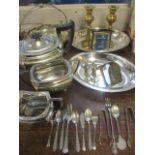 A quantity of silver plate and brassware to include a pair of brass candlesticks and a silver plated